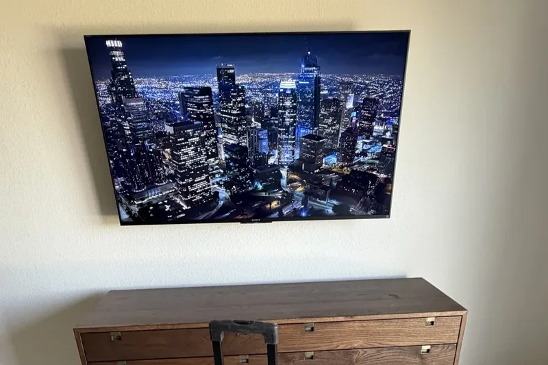65-inch Sony TV wall-mounted with in-wall cable concealment in Hollister