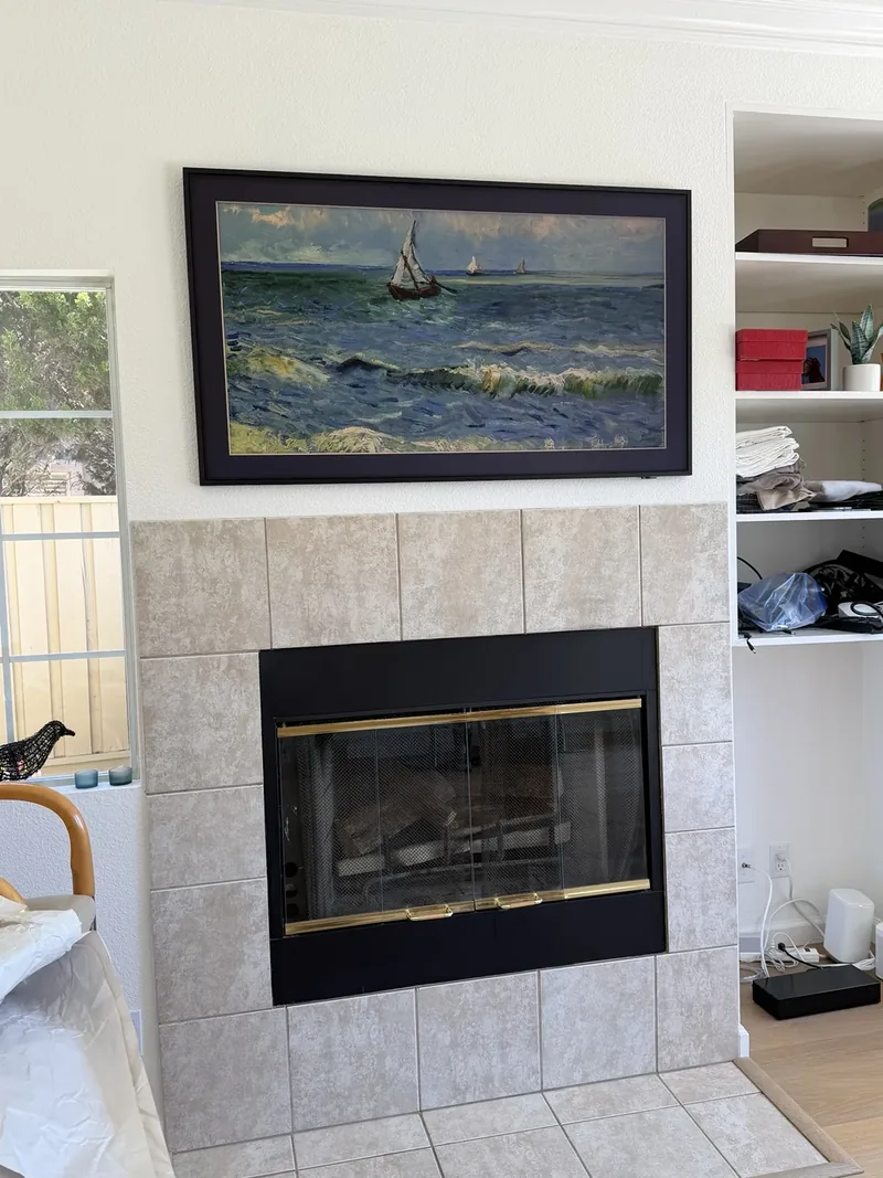 65-inch Samsung Frame TV over fireplace with in-wall cable concealment in Salinas