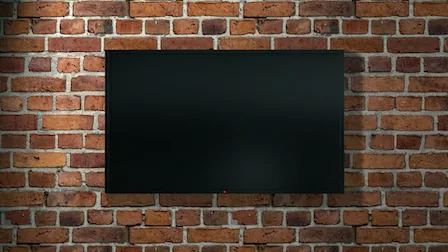 Television mounted on a brick wall