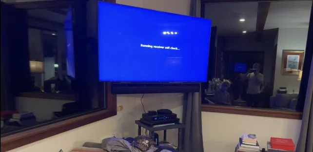 65-inch Samsung TV on full-motion Sanus mount with soundbar in Big Sur