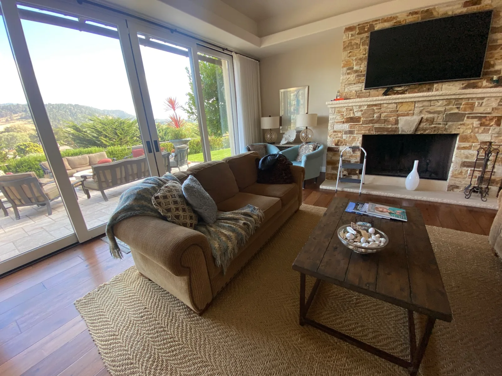 65″ Samsung TV mounted directly on stone over a fireplace in Carmel, CA
