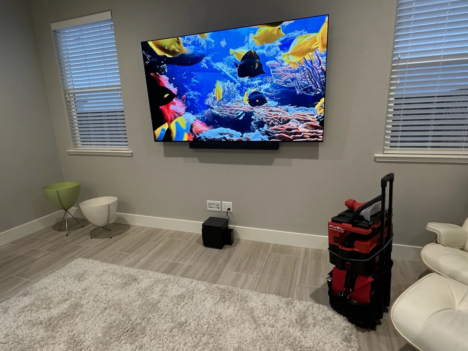 Wall-mounted 75-inch Samsung TV with soundbar below in Cupertino