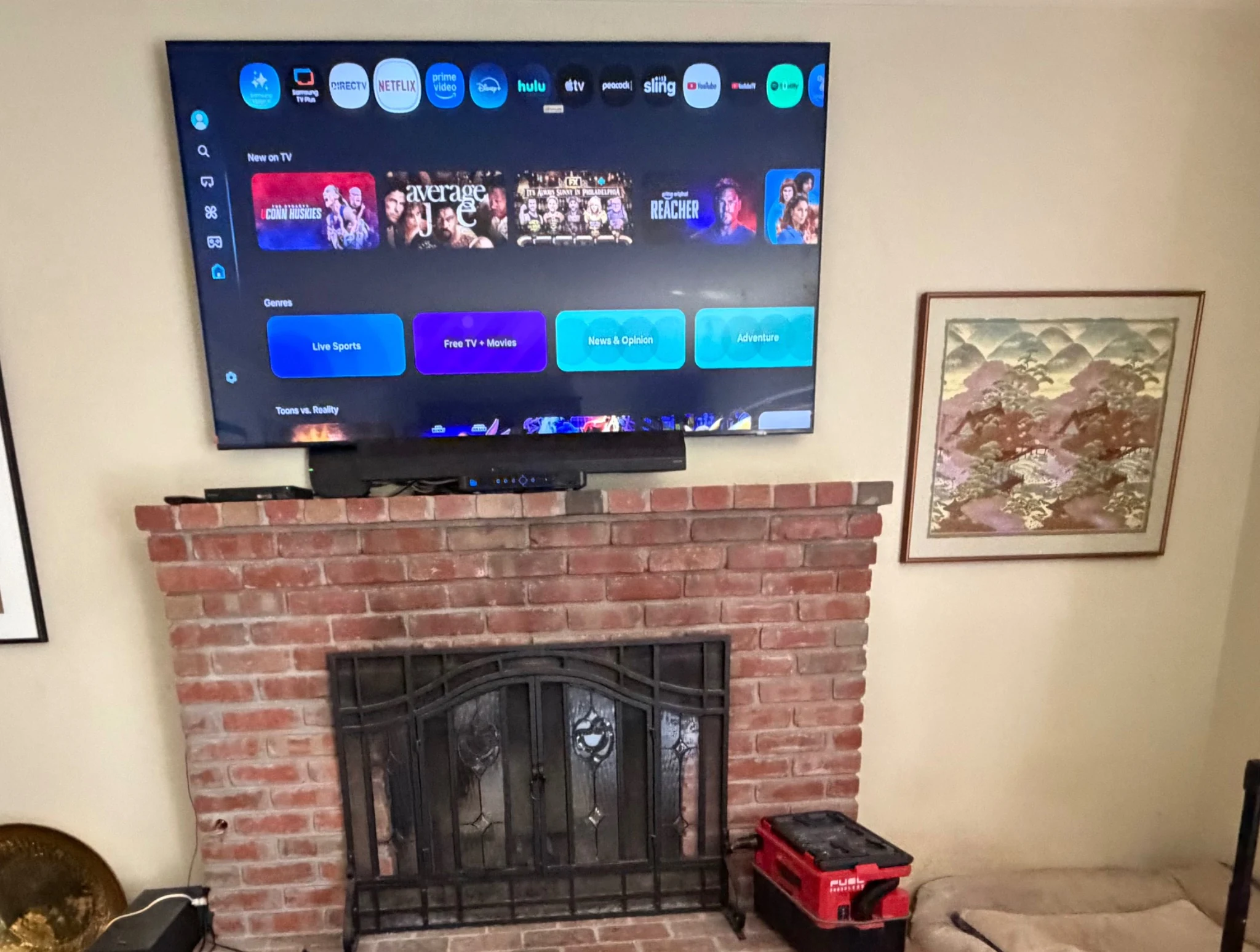 75-inch Samsung TV mounted over a brick fireplace in Gilroy after replacing a 65-inch Sony TV