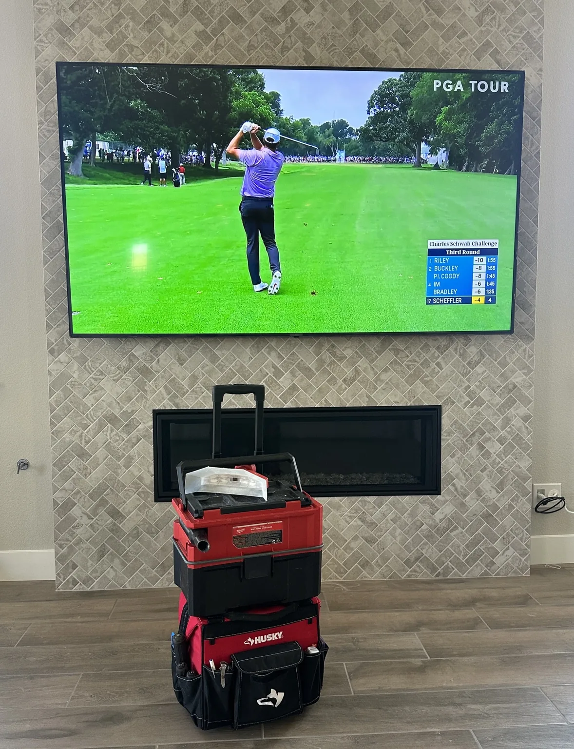 85″ LG TV mounted over a tiled fireplace in Marina, CA