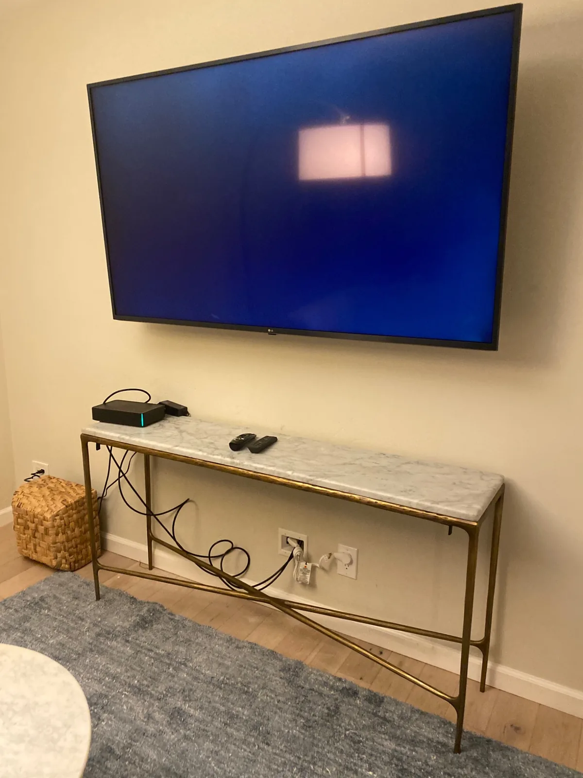 65-inch LG TV wall-mounted with in-wall cable concealment in Monterey