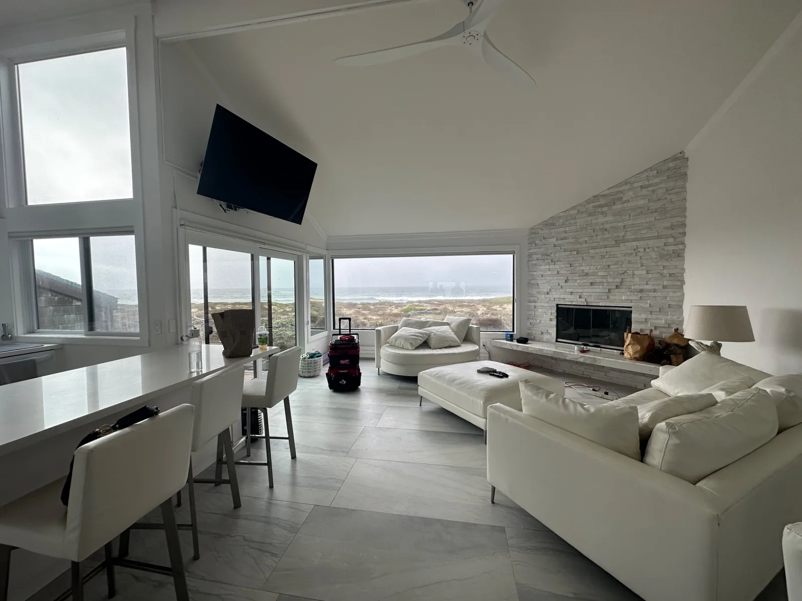 TV mounted high in a corner of an ocean-view room in Moss Landing