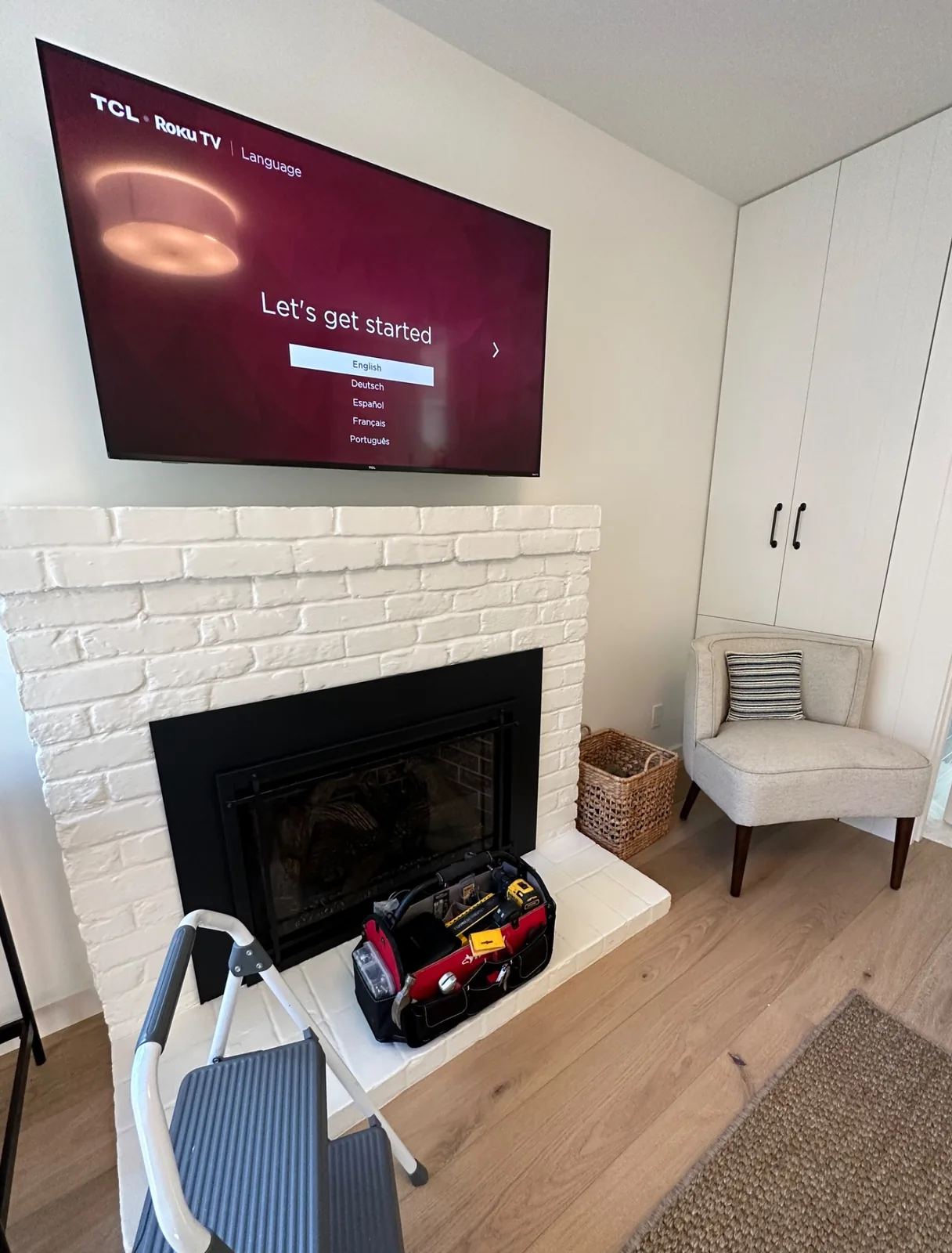 65-inch TCL Roku TV mounted above a fireplace in Pacific Grove