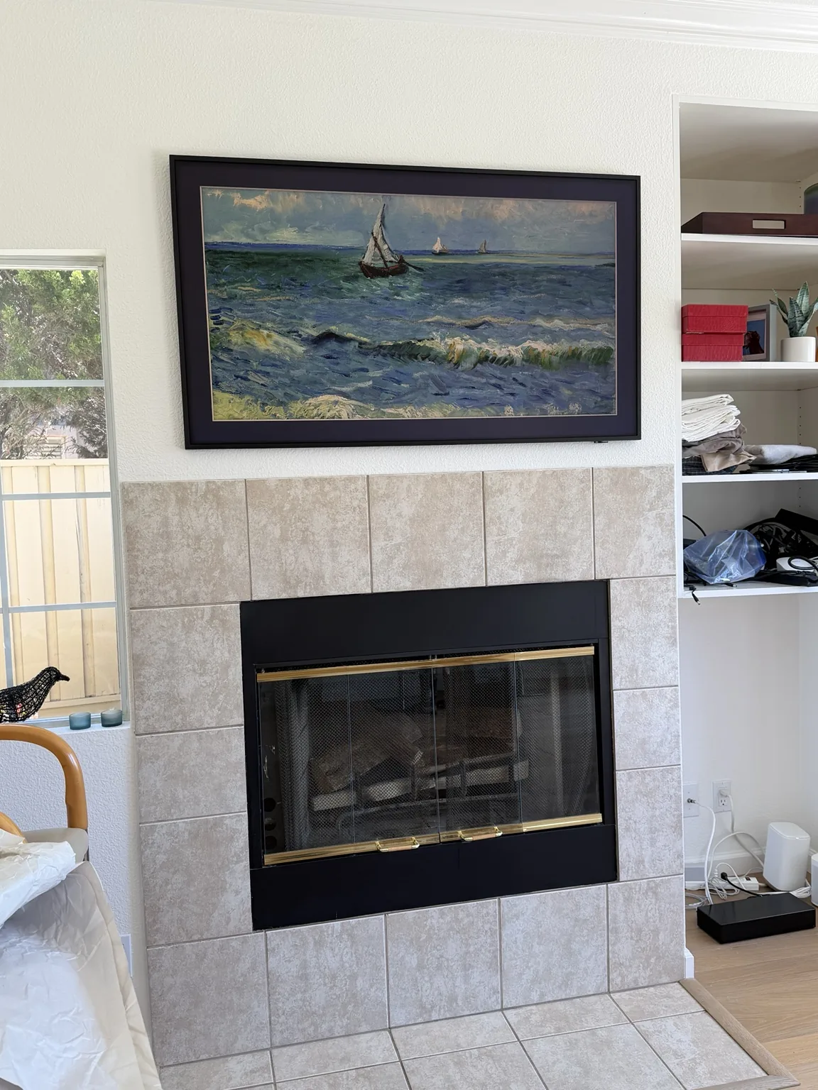 65-inch Samsung Frame TV over fireplace with in-wall cable concealment in Salinas
