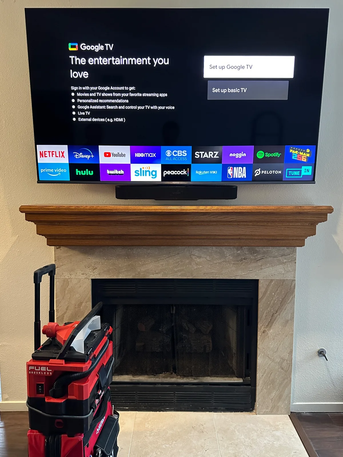 75-inch Hisense Google TV above fireplace with Sonos soundbar in San Jose