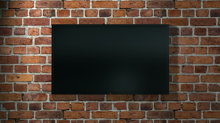 Television mounted on a brick wall